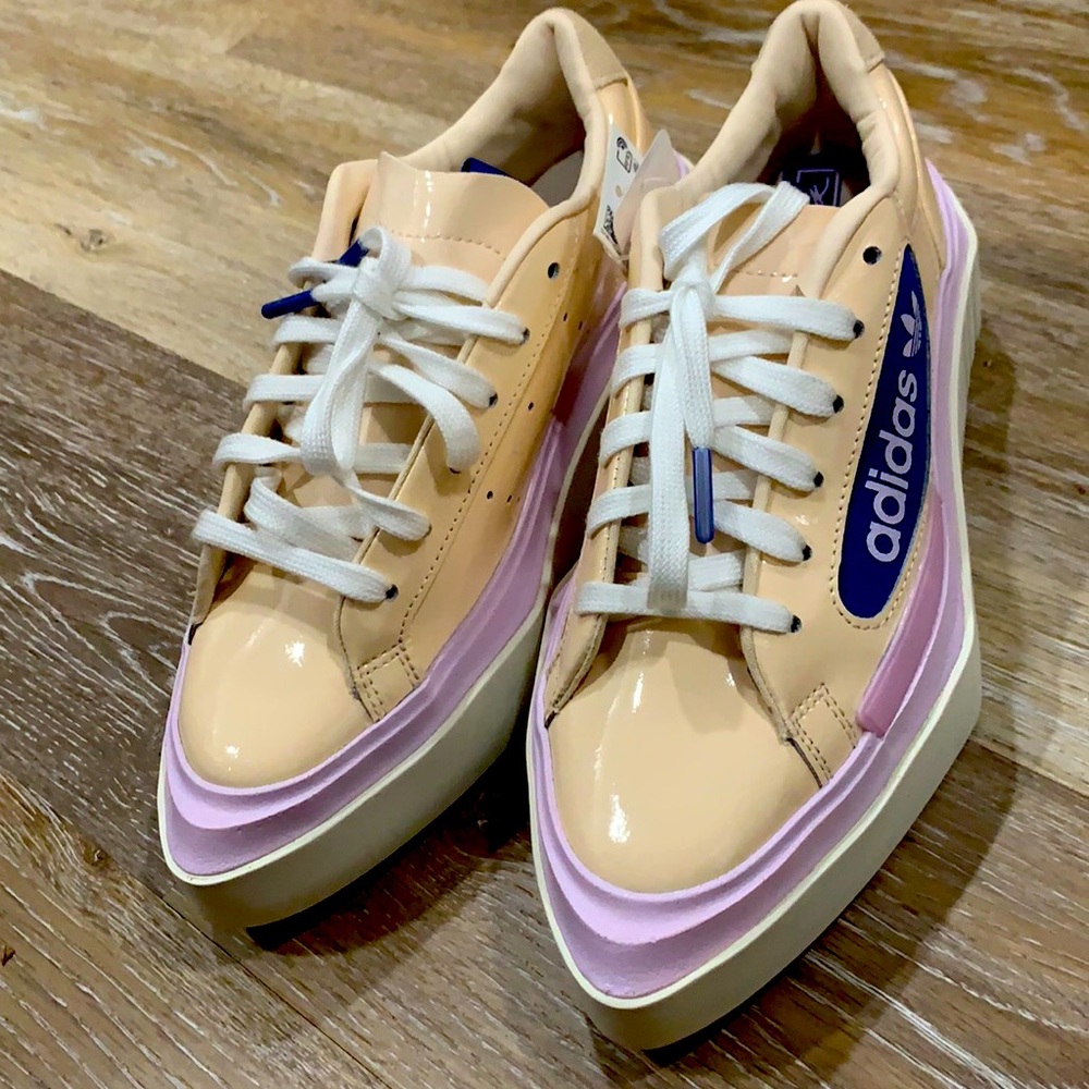 Pastel pink and peach pink adidas sneakers